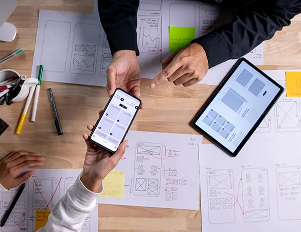 Two People Designing Website Wireframes